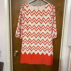 This is adorable dress by Pink Owl. The size is a medium.